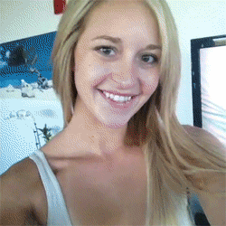 cute blonde With sexy smile lifting her shirt Cute blonde with sexy smile showing tits